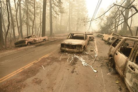 Burnt Out Vehicles Litter The Roads Of Paradise Ca California