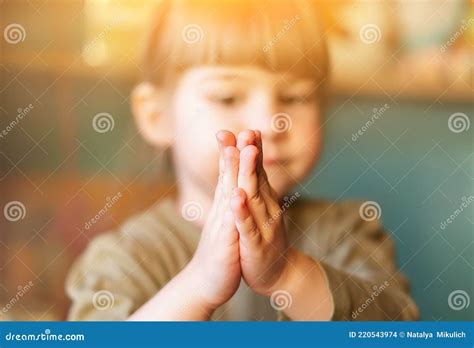 A Small Child Asks The Baby Girl Clasped Her Hands Together For Prayer