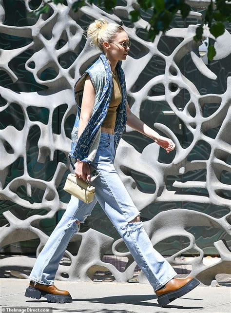 Gigi Hadid Shows Toned Abs In A Cropped Top And Sleeveless Vest As She Steps Out In New York