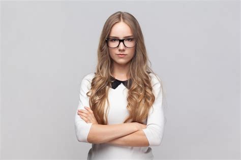 Premium Photo Serious Strict Woman In Glasses Standing Looking At