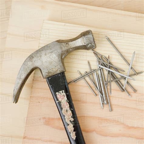 Close Up Of Hammer And Nails Stock Photo Dissolve