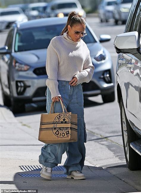 Jennifer Lopez Bundles Up In Cozy White Sweater And Baggy Blue Jeans At