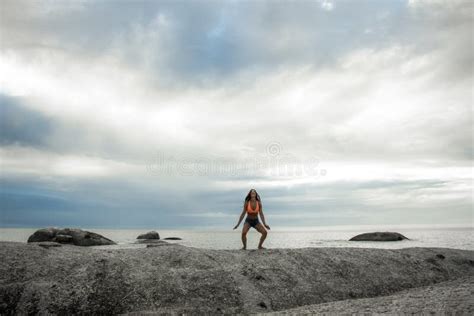 Woman Landing On A Rock At Sunset On Bakovern Beach Cape Town Stock Image Image Of Dusk