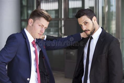 Two Businessmen Looking Serious Into Camera Stock Photo Image Of