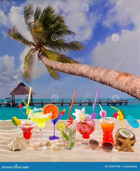 Colorful Tropical Cocktails At Beach On White Sand Royalty Free Stock