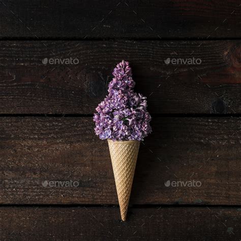 Ice Cream Cone With Purple Lilac On Wooden Background Stock Photo By Zamurovic