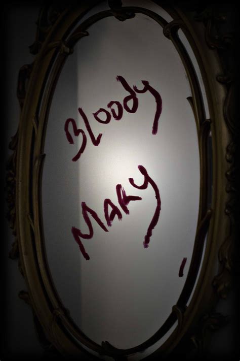 A Mirror With Writing On It That Says Please May In Red And Black Ink