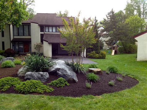 A House With Landscaping In The Front Yard