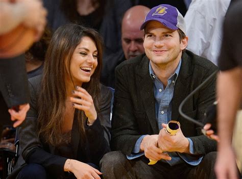 Mila Kunis And Ashton Kutcher Smooch On Kiss Cam At Lakers Game Photo