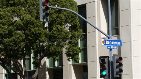 Broadway Street Name Odonym Sign And Traffic Light On Pillar In Usa