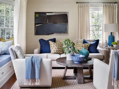 Ivory And Blue Living Room Features Ivory Shiplap Walls Lined With A