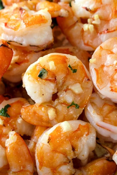 Crab meat is baked with prawns, scallops and plaice fillets in a creamy white sauce. 10 Minute Garlic Butter Baked Shrimp | The Two Bite Club
