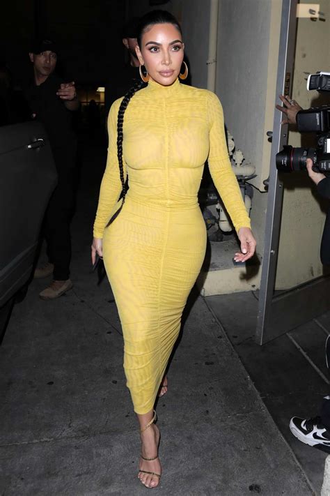 kim kardashian stuns in a form fitting yellow dress as she arrives at carousel restaurant in