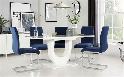 Made from solid wood with a natural finish, the rounded table edges and circular shape create an organic flow that highlights a contemporary modern look. Oslo White High Gloss Extending Dining Table with 6 Perth Blue Velvet Chairs | Furniture Choice