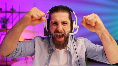 Gamer Bearded Guy In A Gaming Headset Wins A Video Game
