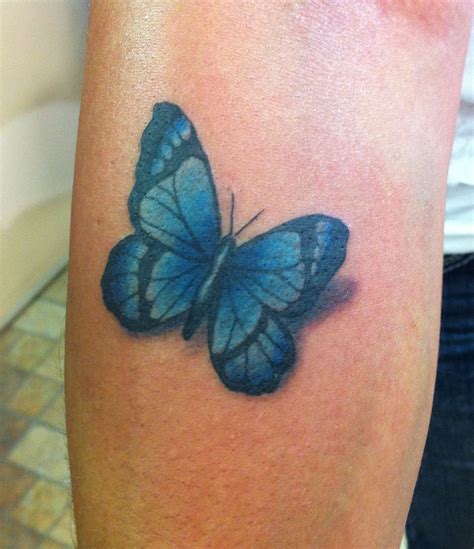 Blue butterfly tattoo the warmest and most serene color is blue, making it a favorite among girls who underwent a heartbreak or those whose personality is calm and never shaken. Tattoos by Wojo: Blue Butterfly