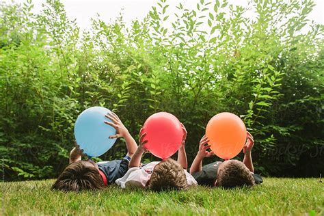 Children Together Blowing Up Balloons Colorful Summer Party By