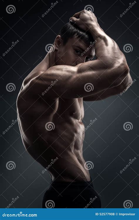 Stunning Muscular Young Men Bodybuilder Looking Behind Stock Photo