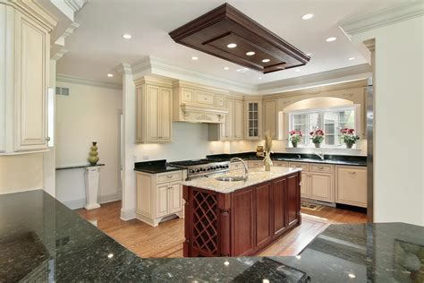 For a detailed look at kitchen island designs, countertop materials, dimensions, and additional features, check out our guide on buying a kitchen island. 31 "New" Custom White Kitchens with Wood Islands