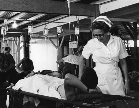 This Is A Photo Of A Wounded Us Soldier And Nurse Amidst The Vietnam
