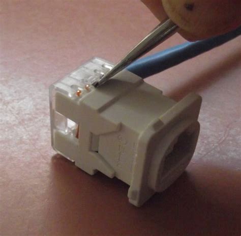 2) untwist the wires back to within 1/8 of the jacket. Terminating Cat5e Cable on a Jack (Wall Mount or Patch Panel)