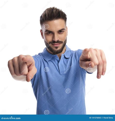 Happy Youngster Pointing Two Fingers At The Camera Man Stock Image