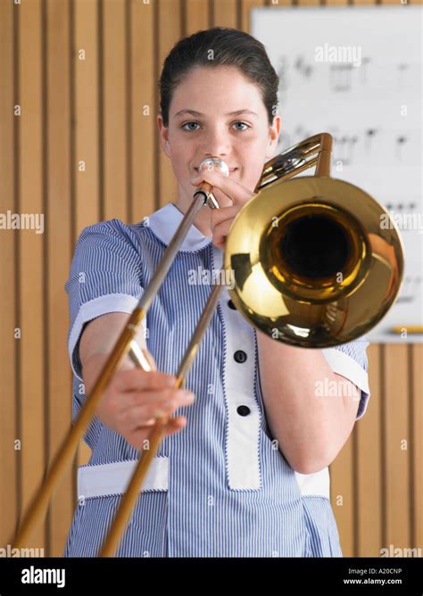High School Girl Playing Trombone In Music Class Portrait Stock Photo