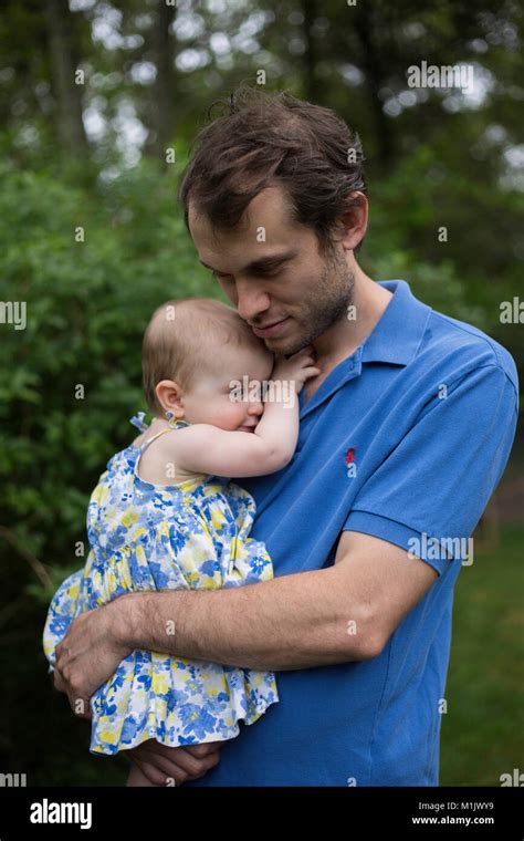 Man Holding Baby Outdoor Stock Photo Alamy