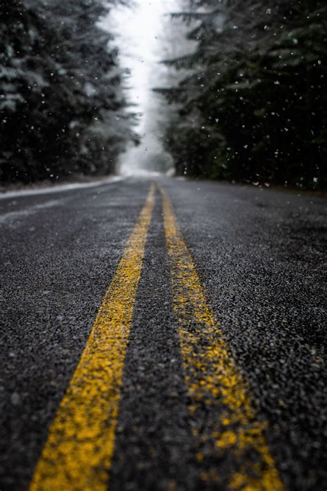 Low Angle Photo Of Road While Raining · Free Stock Photo