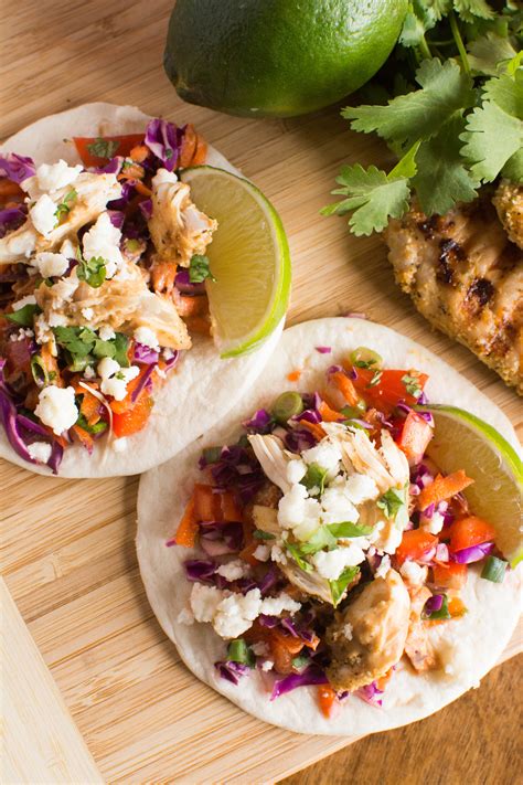 To serve, spoon the chicken inside the shells and top with shredded lettuce and cheese. Grilled Chicken Street Tacos with Spicy Peanut Sauce ...