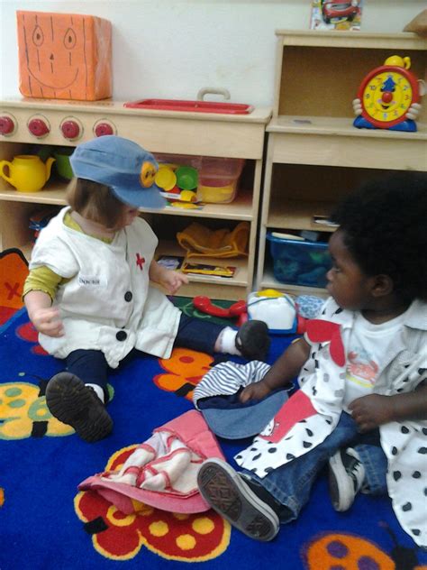 Toddlers Playing Dress Up In Our Home Living Center Dramatic Play Is A