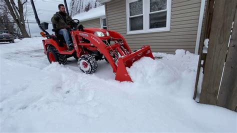 Kubota Bx Plowing Snow Up To 2 Drifts Youtube