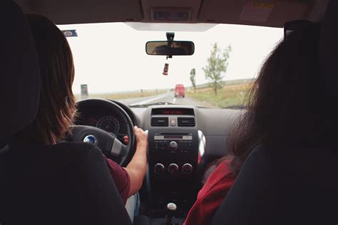two woman sitting inside vehicle car dashboard drive piqsels
