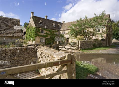 An Old Farmhouse By The Ford In The Cotswold Village Of Duntisbourne