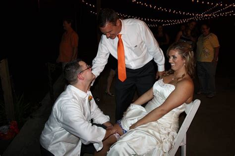 Funny Garter Toss Photo Brides Dad Tapping Groom On Shoulder Watch