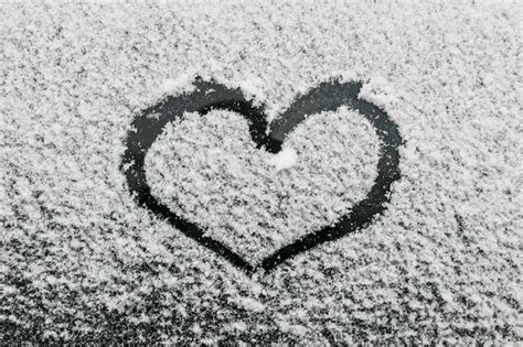 Heart Shape On Snowy Glass During Winter Day Photo Free Download