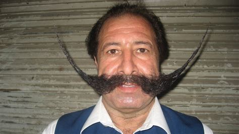 Mustached Pakistani Man Emerges From Hiding Handlebars And All
