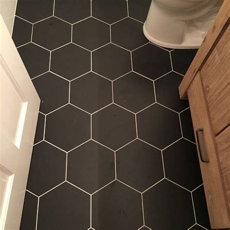 These black and white hexagonal tiles are a little more expensive than some of the other options hexagonal tile has a different rhythm and look than rectangular tile. Tessile Hex 9" x 10" Porcelain Field Tile | Black tile ...