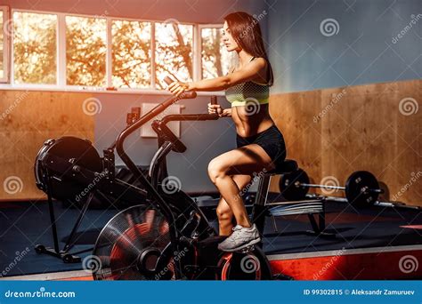 Fitness Female Using Air Bike For Cardio Workout At Crossfit Gym Stock Image Image Of