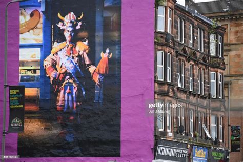 A Mural Of Comedian Billy Connolly Displayed On A Gable Wall In The