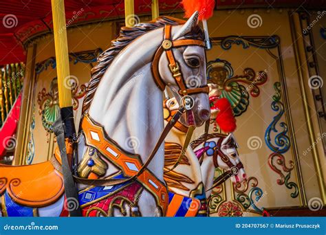 Old French Carousel In A Holiday Park Three Horses And Airplane On A