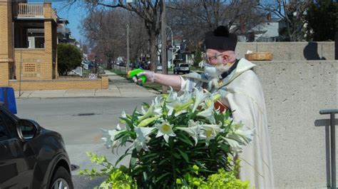 michigan priest draws squirt gun to shoot holy water