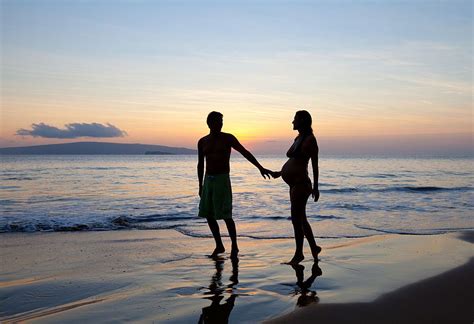 Silhouette Romantic Pregnant Couple At Tropical Beach Sunset In Maui Hawaii Pregnant Couple