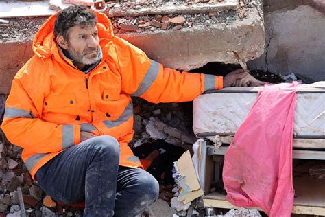 Father Holds Hand Of Daughter Dead Under Rubble In Turkey Earthquake