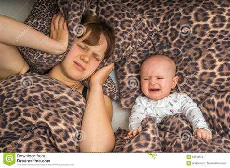 Tired Mother Can T To Sleep Because Her Baby Is Crying Stock Photo
