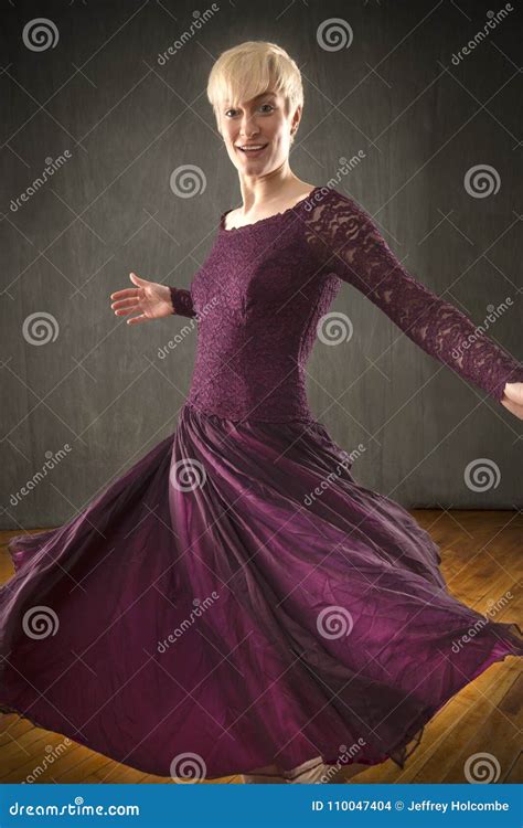 Young Woman In Purple Dress Dancing In The Studio Stock Photo Image