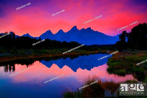 Usa Wyoming Sunset With Grand Tetons Reflected In Beaver Ponds Along