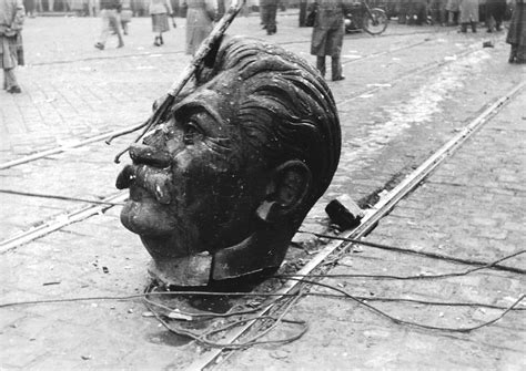 A Disembodied Statue Of Joseph Stalins Head On The Streets Of Budapest