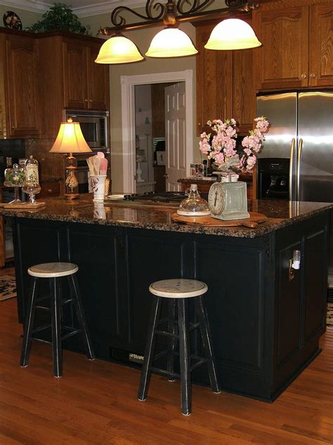 Giving this kitchen island a whole new look has been a major part of my diy kitchen renovation project. Painting An Oak Island Black | Hometalk