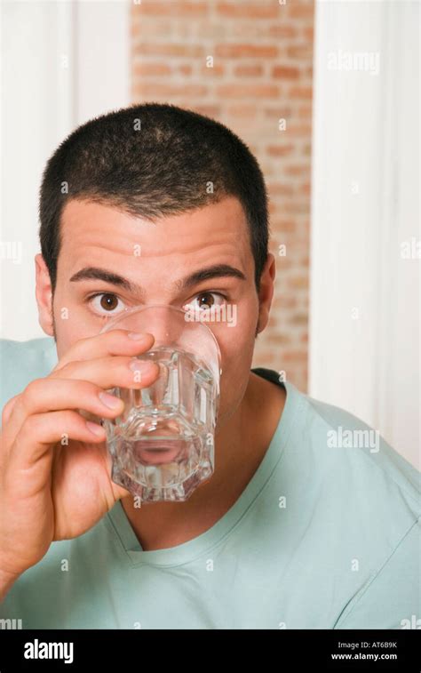 Man Drinking A Glass Of Water Portrait Stock Photo Alamy